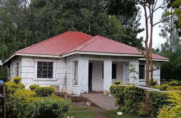 Finished residential bungalow with a red roof and planted garden in Bungoma