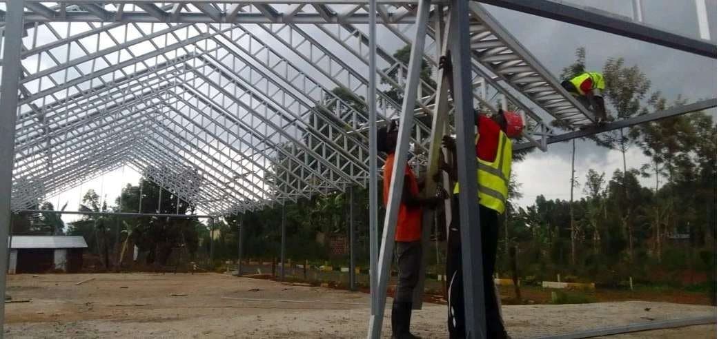 Steel roofing and site team at a church shelter