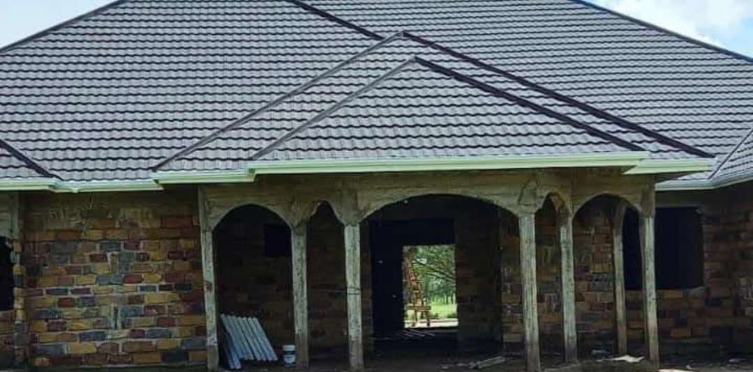Brimana stone-walled residence with an arched veranda and tiled roof in Nyanza